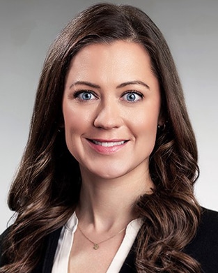 Headshot portrait on gray backdrop of Teresa Datema, Office and Healthcare Advisor at Bradley Company in Grand Rapids