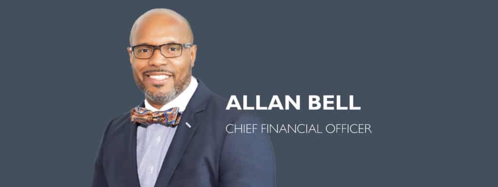 Allan Bell, CPA, CMA, MBA, the Chief Financial Officer of Bradley Company, wearing glasses and navy blue shit with bow tie