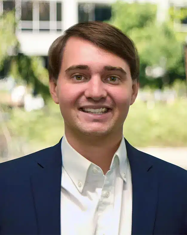 Nathan Robinson headshot outdoors with trees in the background at the Indianapolis office of Bradley Company