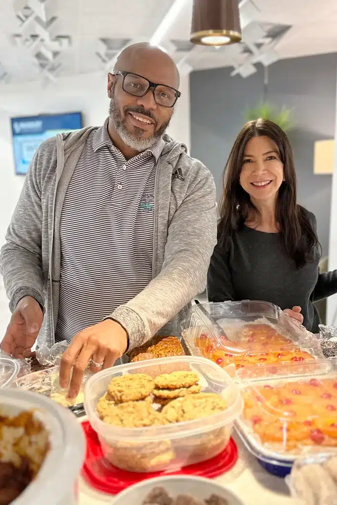 Allan Bell, Chief Financial Officer at Bradley Company, at work event with commercial real estate broker, JoLynn Shallop Wright